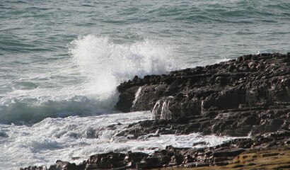 Waves at the rocky coastline in Luz, Lagos, Algarve - Portugal 