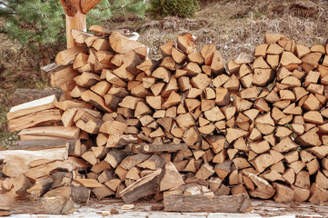 Beautifully stacked firewood. Natural wood for the furnace. Natural texture.