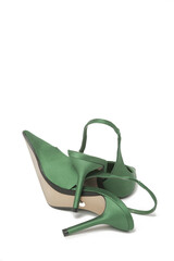 Green satin slingbacks heels with the classy pointed toe isolated on white backgrounds