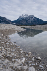 Forggensee with mountains an little water