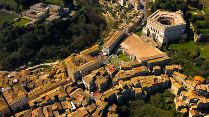 Aerial view of the Villa Farnese, a pentagonal mansion in Caprarola, near Viterbo, Italy. It is a massive Renaissance and Mannerist construction. It is built on a five-sided plan in reddish gold stone