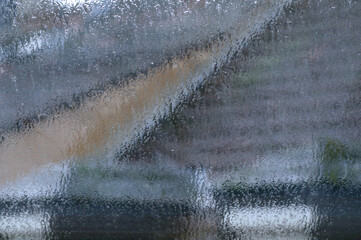 Raindrops on the window, close-up, abstract background.