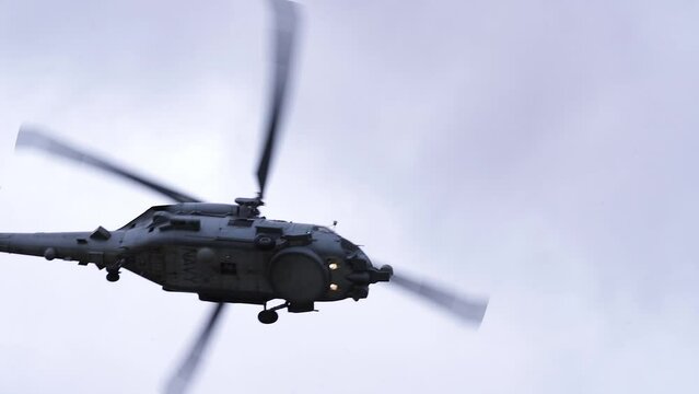 MH-60R Seahawk Helicopter In The Sky - low angle