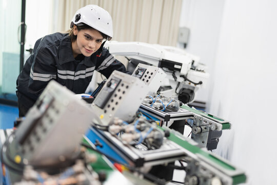 Engineer caucasian woman checking and repair electric machine in machine lap	
