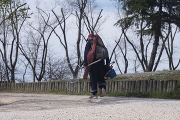 Fisherman with a multitude of fishing utensils