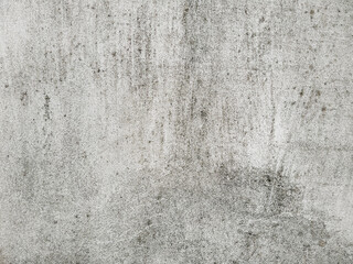 An old gray cement surface background. Damaged concrete wall with detailed grunge texture.