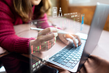 Businessman checking stock chart on a laptop computer
