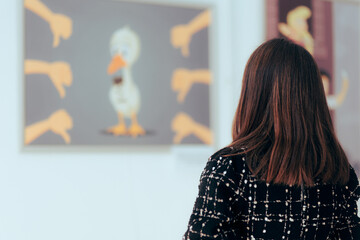 Woman Looking at a Painting in an Art Gallery. Art critic visiting an exhibition checking modern satirical illustrations  - obrazy, fototapety, plakaty