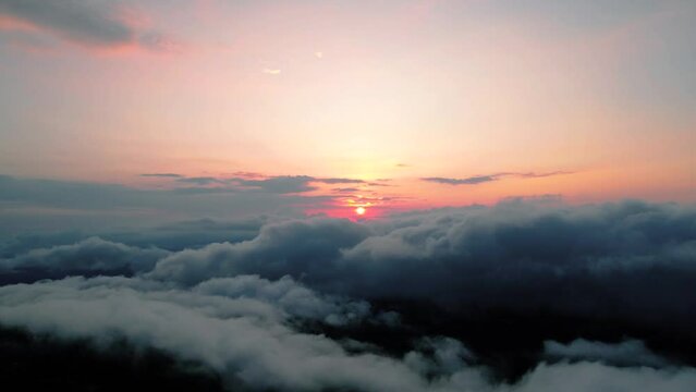 Sunrise view from above overcast clouds, aerial view
