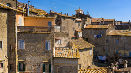 Aerial view of Caprarola, a small town near Viterbo, Italy. All houses have traditional red tiled roofs.
