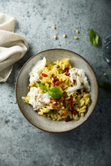 Pasta with fresh cheese and tomatoes