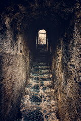 Ancient stairs in dungeon tunnel in Doria Castle in Porto Venere, Italy