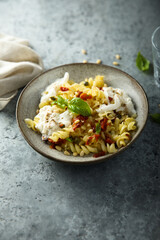 Pasta with fresh cheese and tomatoes
