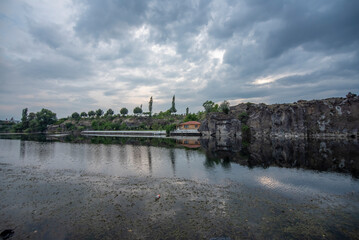 Wonderful panoramic view of Salihli Adala Canyon, forest reflection cliffs and blue clouds in the sky