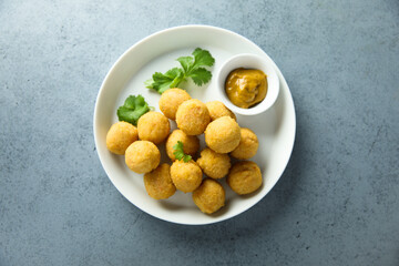 Homemade salmon croquettes with mustard