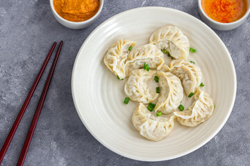 Chicken Dumplings with Spicy Condiments Top Down Photo