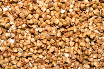 Fototapeta premium Buckwheat groats top view.The texture of buckwheat.Buckwheat background.