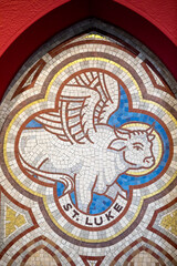 St Paul's catholic church, Belfast, Northern Ireland. Symbol of evangelist St Luke. Ulster, U.K.