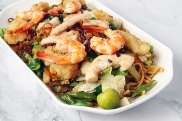 Freshly cooked Filipino food called Pancit Canton with seafood
