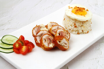 Freshly cooked Chicken Cordon Bleu served with fried rice and egg