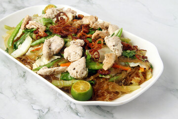 Freshly cooked Filipino food called Pancit Bihon with chicken