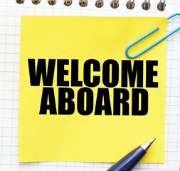 WELCOME ABOARD words on a small yellow piece of paper.