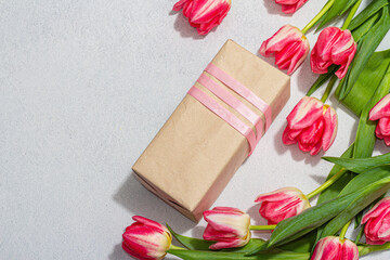 Zero waste spring gift concept. Pink tulips, surprise box for Anniversary, Mothers or Valentines Day