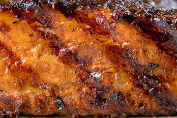 Obraz na płótnie Canvas Texture of fried fillet glazed pork, close-up. Grilled Pork Rib