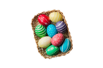 Fototapeta na wymiar Basket of colorful Easter eggs isolated on white background. Easter basket filled with colored eggs top view holiday concept