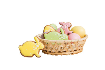 Colorful easter cookies in basket with Multi colors Easter eggs isolated on white background. Pastel color Easter eggs. holiday concept