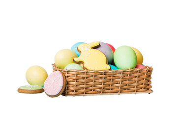 Colorful easter cookies in basket with Multi colors Easter eggs isolated on white background. Pastel color Easter eggs. holiday concept