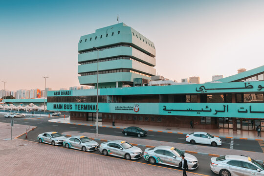 14 January 2023, Abu Dhabi, UAE: intercity bus terminal station with waiting passengers