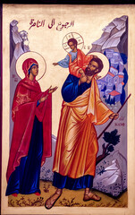 Fototapeta na wymiar Icon in the Nazareth melkite (Greek catholic) chuch, Galilee, Israel. The Holy family returning to Nazareth.