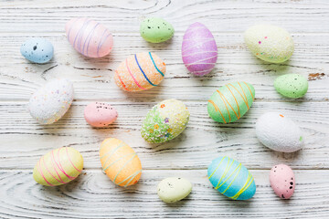 decorative easter eggs on colored background. easter eggs collection top view with copy space