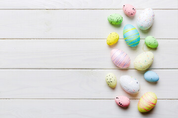 decorative easter eggs on colored background. easter eggs collection top view with copy space