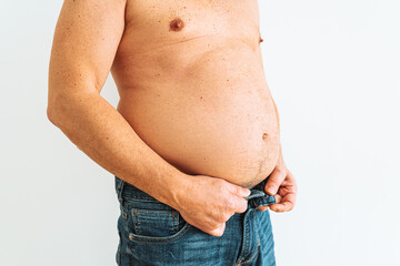 Fat man with a big belly on a white background. The concept of weight loss.