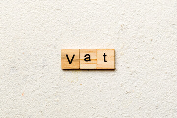 Vat word written on wood block. Vat text on table, concept