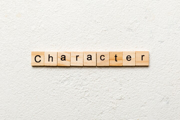 CHARACTER word written on wood block. CHARACTER text on cement table for your desing, concept