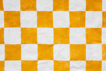 Checkered orange white painted retro canvas background