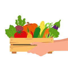 Hands hold a wooden box with vegetables