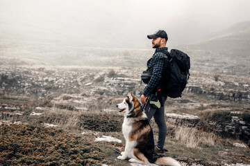 Man Hiking with Husky