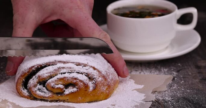 Wheat bun with poppy seed filling, a large amount of sweet poppy seed filling in wheat flour buns