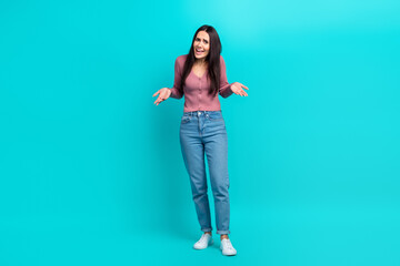 Full body length photo of unhappy mad woman wear stylish shirt denim jeans shrug shoulders bad mood furious isolated on aquamarine color background - obrazy, fototapety, plakaty