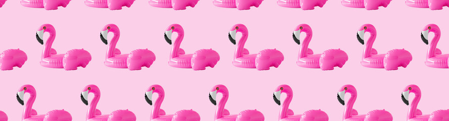Fototapeta premium Seamless pattern for textiles and wrapping paper. Pink background, pink inflatable flamingo beach circles, the concept of summer time, beach holidays. 3d render illustration.