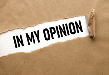 My opinion text on white sheet of paper on craft background, business concept