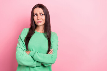 Photo of young minded intelligent ponder thoughtful woman wearing green pullover folded hands look mockup isolated on pink color background - obrazy, fototapety, plakaty