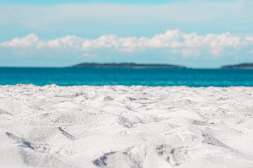 White sand beach with sky and white clouds