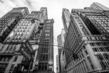 Manhattan street view with big buildings, New York, USA. Black and white