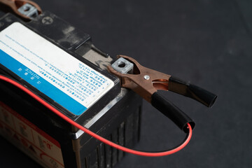 Charging motorcycle battery, battery maintenance and repair concept
