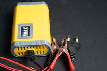 Motorcycle battery charger with clamp cable
